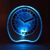 A close-up shot of a glowing alarm clock at night. Produktbild-Vorschau