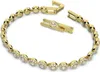 A gold-colored tennis bracelet with clear stones, shown with its clasp open. Anteprima dell’immagine prodotto