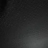 A close-up, textured view of a dark fabric with a pattern of small raised dots. Produktbild-Vorschau