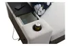 Close-up of a modern sectional sofa's armrest, featuring a built-in storage compartment, a cup holder with a can of soda, and a charging phone. Produktbild-Vorschau