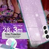 A close-up of a phone case with glitter, showing drop test information and a person's feet in the background. Produktbild-Vorschau