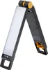 A foldable LED work light with a battery. Produktbild-Vorschau