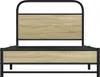 A front view of a bed frame with a black metal frame and wood-effect panels. Náhľad obrázku produktu