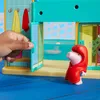 A child's hand opens a door to a toy water park playset. Náhľad obrázku produktu