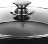 A close-up view of the lid of a pot or pan, showing the handle and a portion of the glass lid. Náhled obrázku produktu