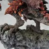 A close-up view of a detailed statue of a monster's claw and leg resting on a rocky surface. Produktbild-Vorschau