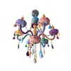 A colorful chandelier with multiple arms and decorative elements. Produktbild-Vorschau