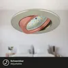 A modern ceiling light fixture with adjustable LED lighting is shown mounted on a white ceiling, with a blurred bedroom scene in the background. Anteprima dell’immagine prodotto