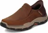 A single brown Skechers men's slip-on shoe is shown against a white background. Voir les images du produit