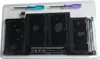 A laptop battery and two screwdrivers are displayed in a clear plastic package against a white background. Produktbild-Vorschau