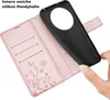 A hand is holding a black phone case over an open rose gold flip phone case with card slots and a butterfly design. Produktbild-Vorschau