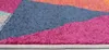 A close-up view of a colorful geometric rug. Náhled obrázku produktu