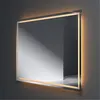 A modern, illuminated mirror mounted on a dark gray wall. Anteprima dell’immagine prodotto