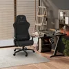 A gaming setup with a chair, desk, computer, and monitor in a room. Produktbild-Vorschau