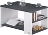 A modern coffee table with storage shelves, featuring books, a decorative object, and cups on top. Anteprima dell’immagine prodotto