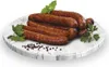 A plate of sausages with herbs and peppercorns. Náhled obrázku produktu