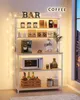A coffee bar setup on a shelf unit, featuring a coffee maker, microwave, bottles, and decorative items. Náhled obrázku produktu