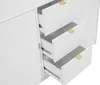 A close-up view of a white dresser with three drawers partially open, revealing gold handles. Anteprima dell’immagine prodotto