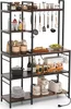 A kitchen baker's rack filled with various kitchen items. Voir les images du produit