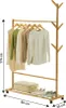 A bamboo garment rack with clothes hanging on it and shoes and a storage bag on the bottom shelf. Produktbild-Vorschau