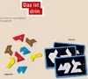 A collection of colorful geometric puzzle pieces and challenge cards for a game. Produktbild-Vorschau