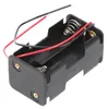 A black plastic battery holder with two compartments, each with a spring terminal. Red and black wires extend from the holder. Anteprima dell’immagine prodotto