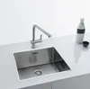 A stainless steel kitchen sink with a modern faucet, a white bottle with a black band, and a small black bowl on a white countertop. Podgląd zdjęcia produktu
