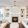 A living room with a fireplace, sofas, and a chandelier. Podgląd zdjęcia produktu