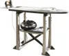 An ironing board with an iron and some folded clothes. Voir les images du produit