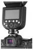 A close-up view of a camera flash unit mounted on a camera. Podgląd zdjęcia produktu