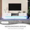A modern white TV stand with LED lighting, displaying a TV and electronic devices. Produktbild-Vorschau