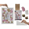 A collage of images showing a wedding guest book frame with wooden hearts, a hand placing a heart into the frame, and stacks of hearts. Produktbild-Vorschau