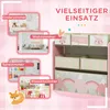 A marketing image showing a pink storage unit with fabric boxes, illustrating its use in different rooms. Náhľad obrázku produktu