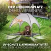 A dog is resting on a raised dog bed with a canopy in a backyard setting. Produktbild-Vorschau