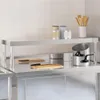 A stainless steel shelf unit for a kitchen table, with kitchen items on it. Anteprima dell’immagine prodotto