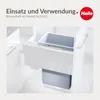 A close-up view of a white kitchen cabinet interior with a grey trash bin insert and a smaller white bin inside. Voir les images du produit