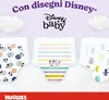 Three Disney-themed baby diapers are displayed against a light purple and white background, with clouds at the top. The text "Con disegni Disney®" and the "Disney baby" logo are visible at the top. Podgląd zdjęcia produktu