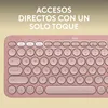 A close-up view of a pink Logitech keyboard with Spanish QWERTY layout, featuring promotional text at the top. Produktbild-Vorschau