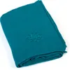 A folded teal yoga blanket with a lotus flower embossed on it, shown on a white background. Produktbild-Vorschau