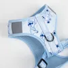 A close-up view of a light blue dog harness with a Stitch pattern. Náhled obrázku produktu