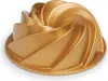 A gold bundt cake pan with a swirling design. Podgląd zdjęcia produktu