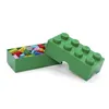 A green LEGO brick-shaped storage box with a lid, filled with colorful LEGO bricks. Anteprima dell’immagine prodotto
