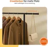 A close-up image shows shirts hanging on a garment rack with a handbag also hanging from the rack. Text overlays indicate features of the product. Produktbild-Vorschau