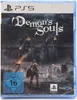 The image shows the front packaging of the Demon's Souls PS5 game. The cover art depicts a knight in armor facing a dark, imposing castle with figures in the background. Produktbild-Vorschau