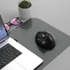 A close-up shot of a desk setup with a laptop, mouse, and a small potted plant. Produktbild-Vorschau