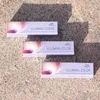Three boxes of Wella Professionals Illumina Color hair dye are arranged diagonally on a textured stone surface, with shadows cast from above. Anteprima dell’immagine prodotto