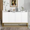 A white sideboard with a gold metal frame is displayed in a room with a painting on the wall and decorative items on top. Anteprima dell’immagine prodotto