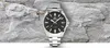 A silver Casio Edifice watch with a black face is displayed against a textured gray rock background. Produktbild-Vorschau