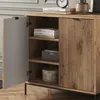 A close-up view of a wooden cabinet with one door open, revealing shelves with books and a decorative box. Produktbild-Vorschau