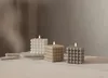 Three bubble candles of different colors are arranged on a white surface in front of a neutral background. Podgląd zdjęcia produktu